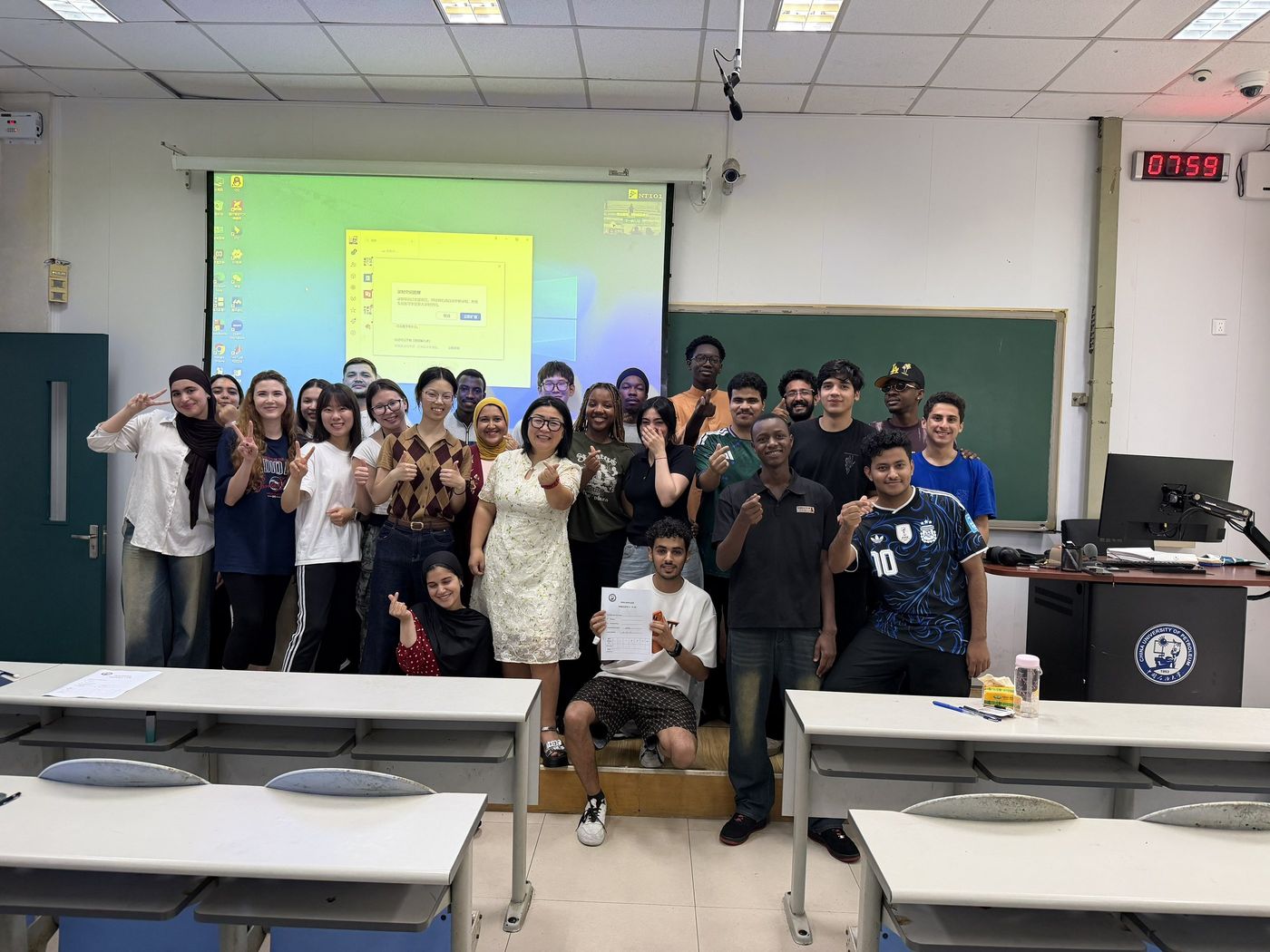 Group photo of international students in a classroom